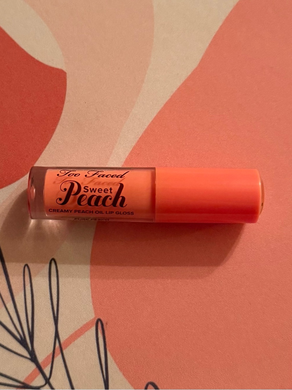 Too Faced Sweet Peach Lip Gloss in Peach Coral
